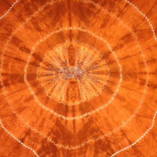 Photo of decorative stitching on marigold & madder dyed cloth