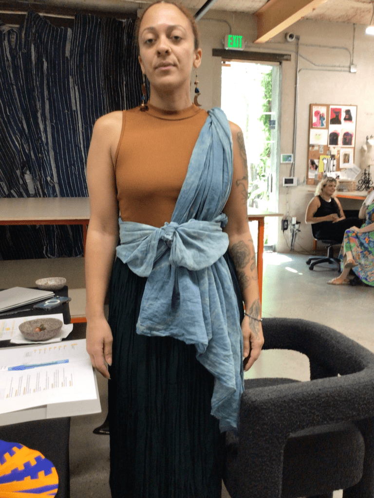 Photo of customer wearing an Otaphiaaki Fashion Week scarf or shawl.